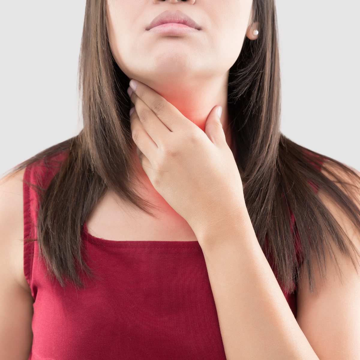 Image of woman holding her neck.