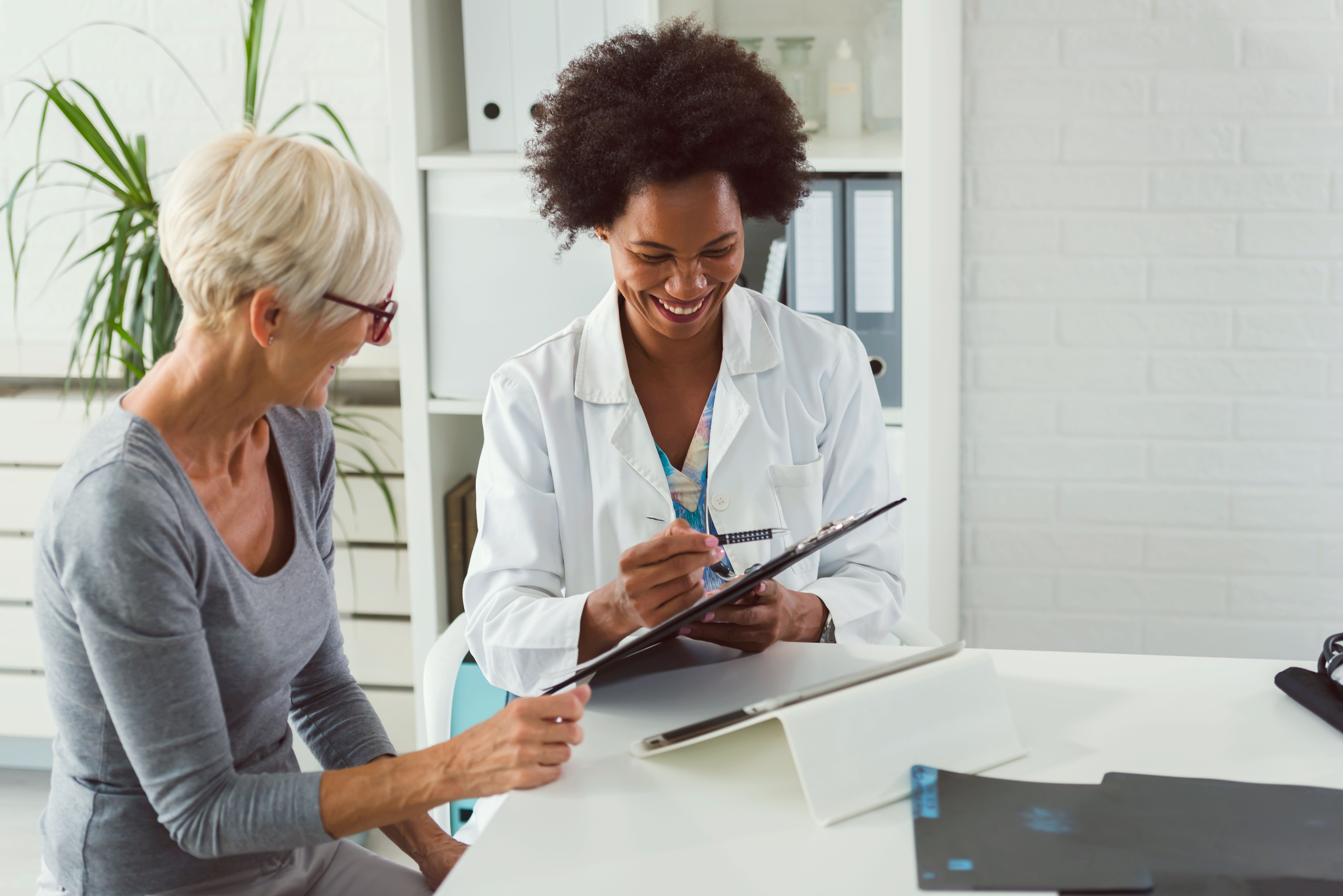 Patient and health care professional -- Image credit: lordn | stock.adobe.com