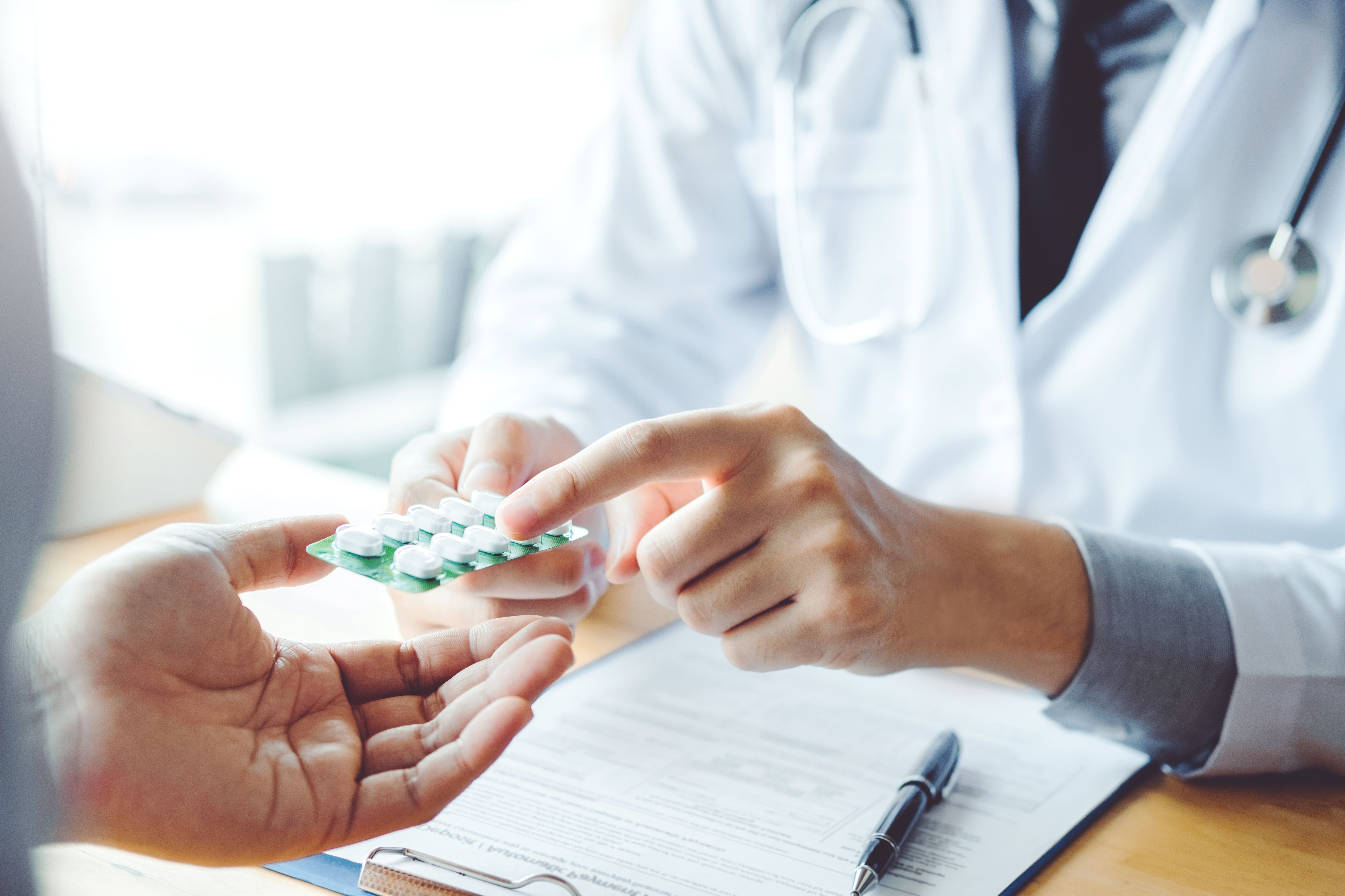 Doctor or physician recommend pills medical prescription to male Patient hospital and medicine concept - Image credit: joyfotoliakid | stock.adobe.com