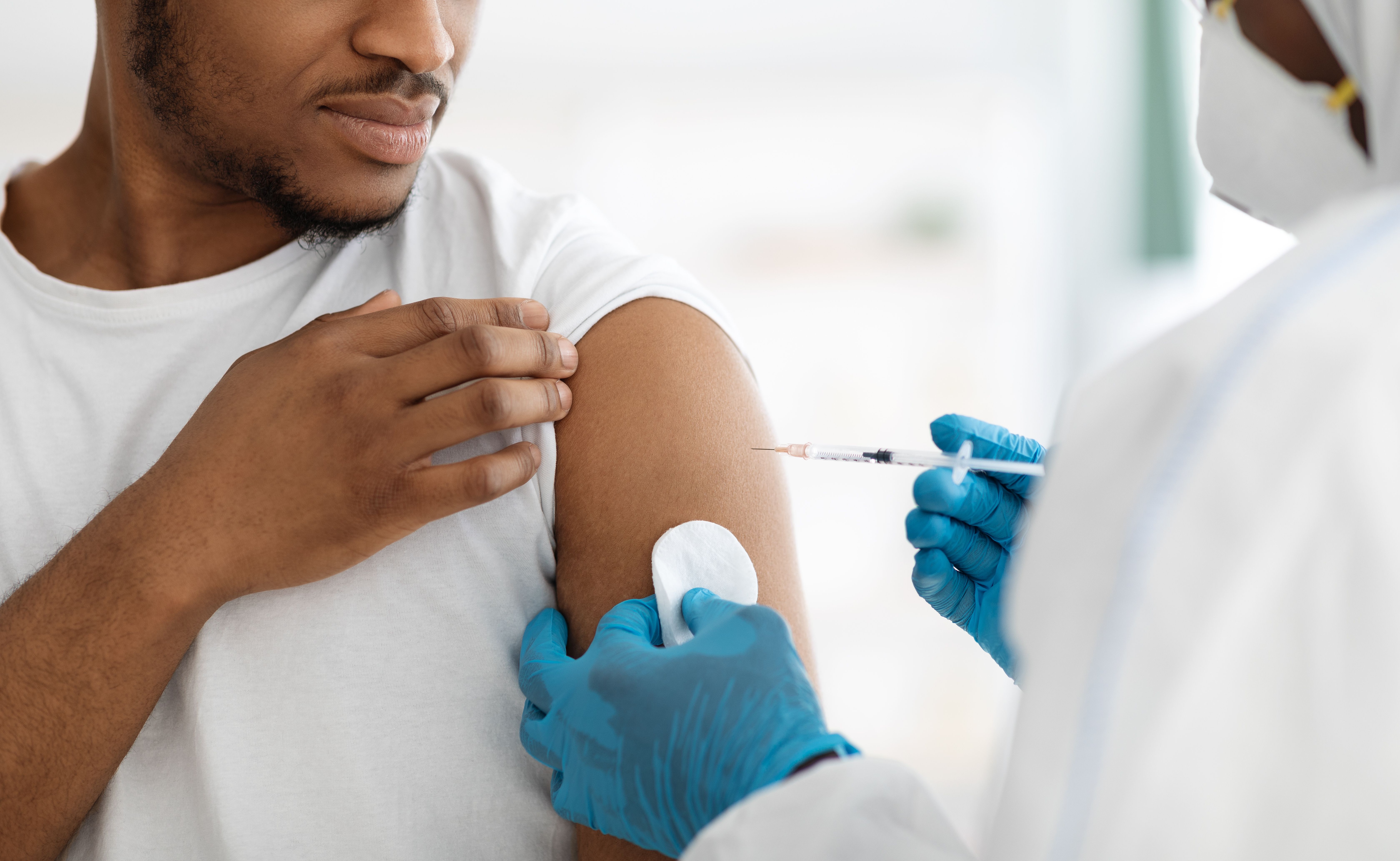 Man receiving a vaccine -- Image credit: Prostock-studio | stock.adobe.com