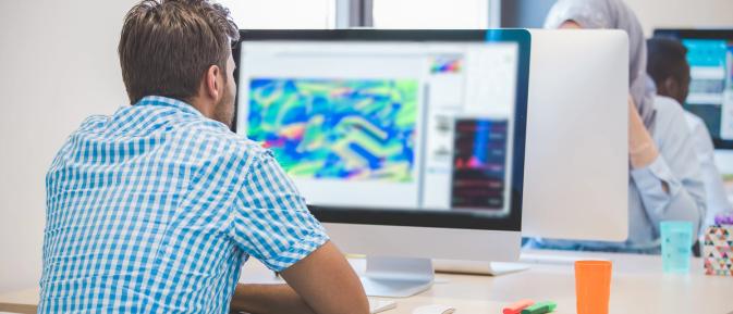 Man looking at concepts on a computer