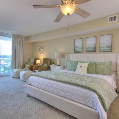 Primary bedroom with views of the Intracoastal Waterway in a Myrtle Beach vacation rental.