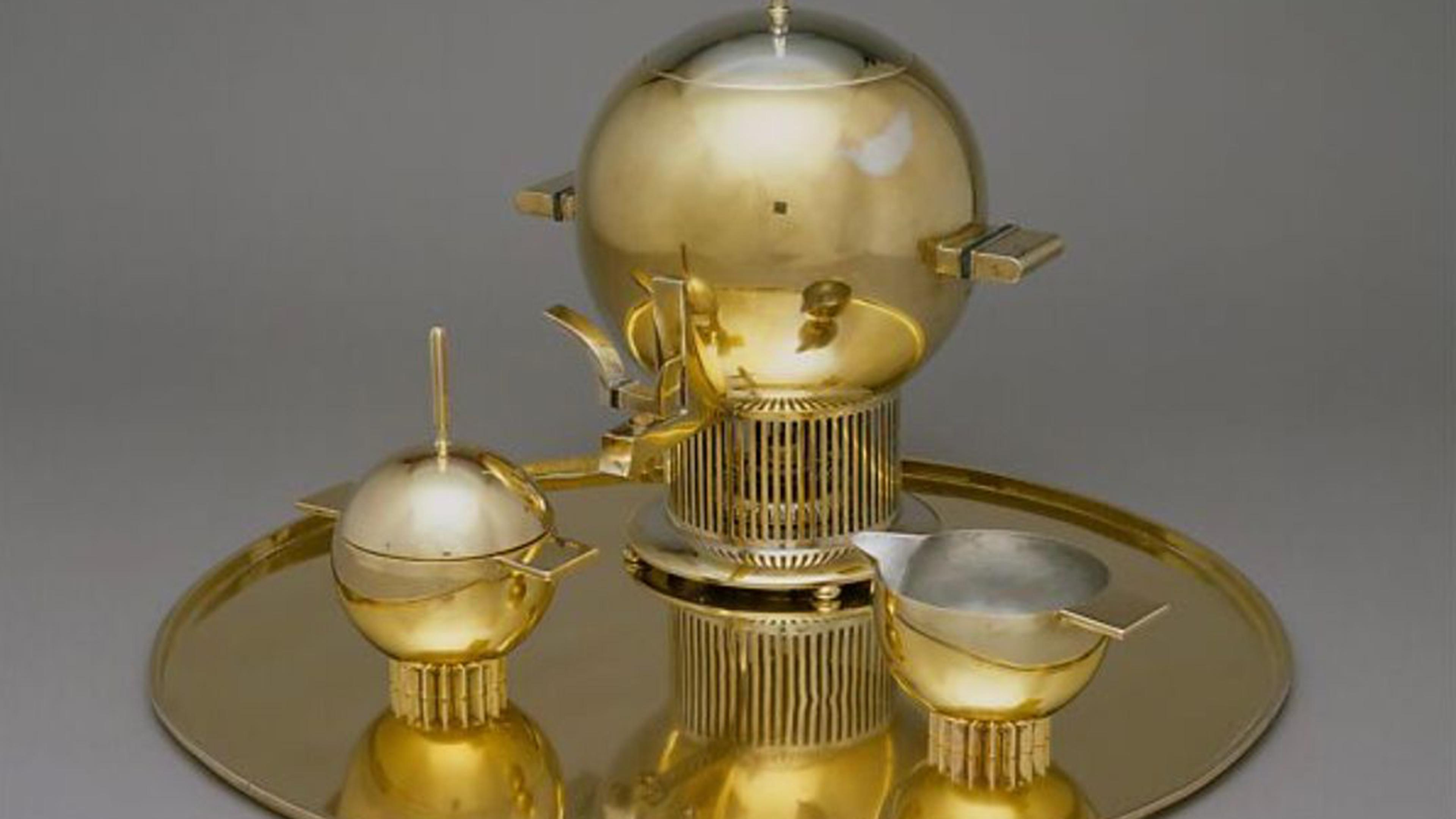 A geometric tea service made from brass