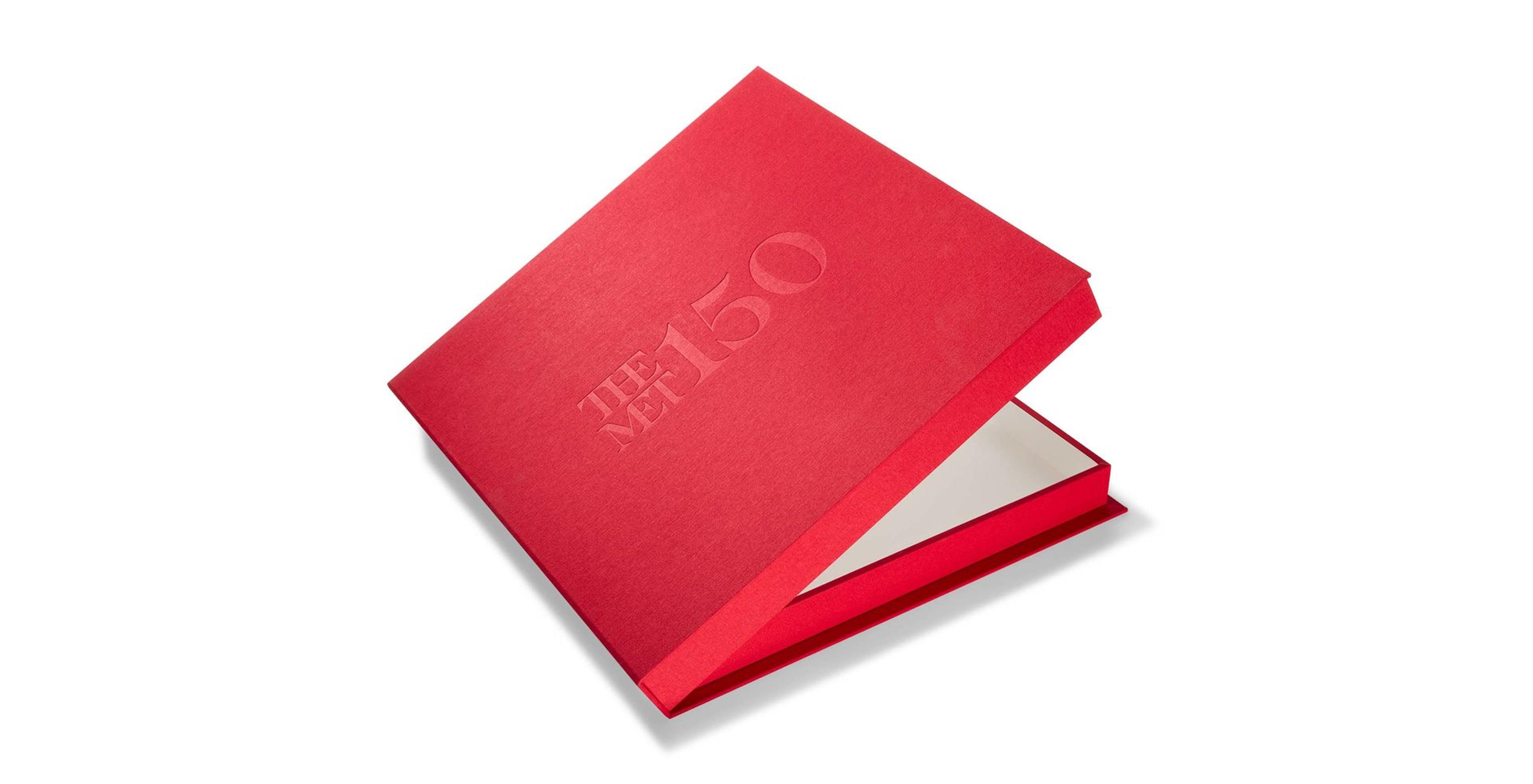 The Met 150th Print Portfolio box, in bright red