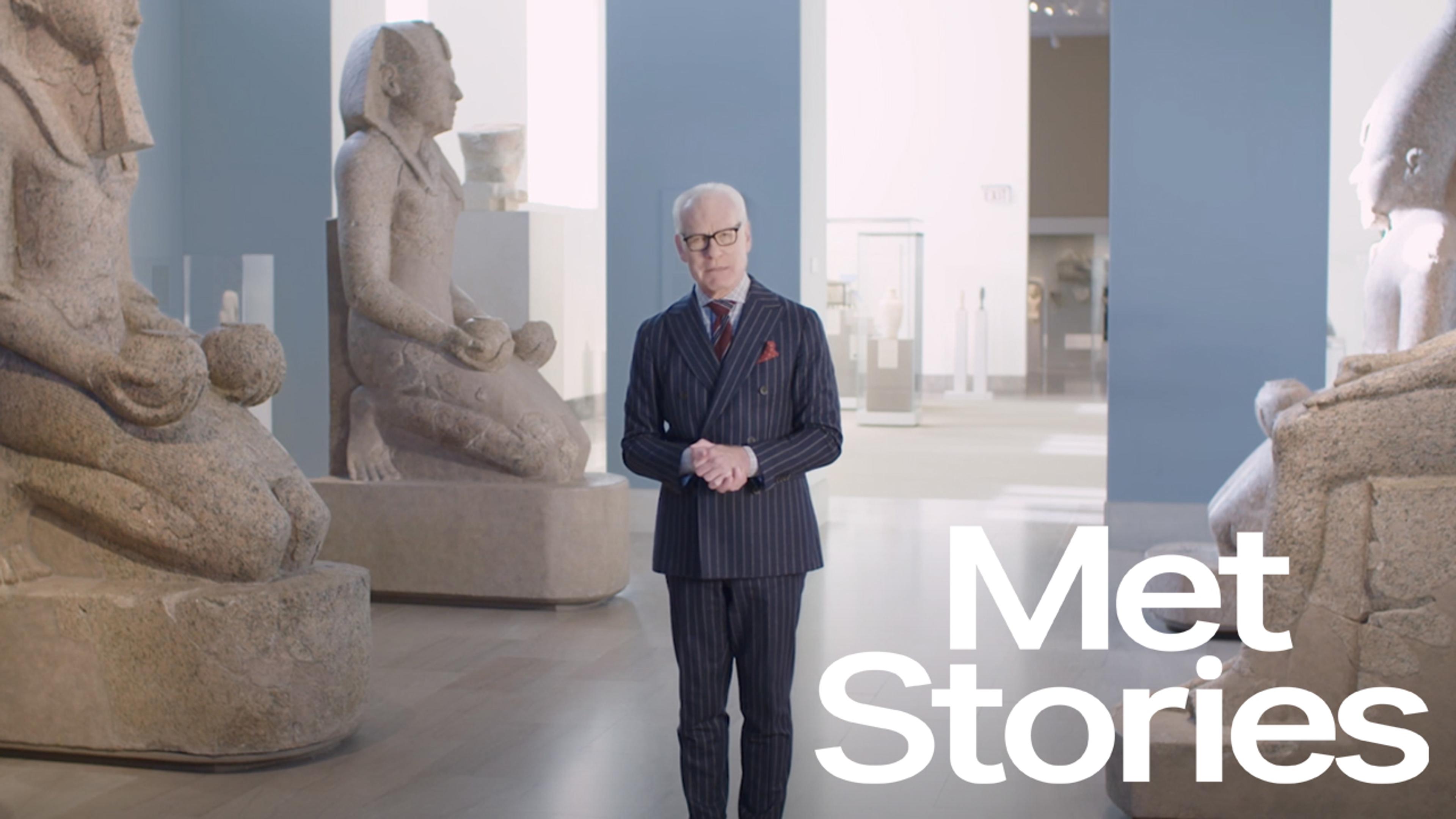 Composite image with Tim Gunn in a blue pin striped suit on the right, with an image of an Egyptian sphinx and gold sandals on the left