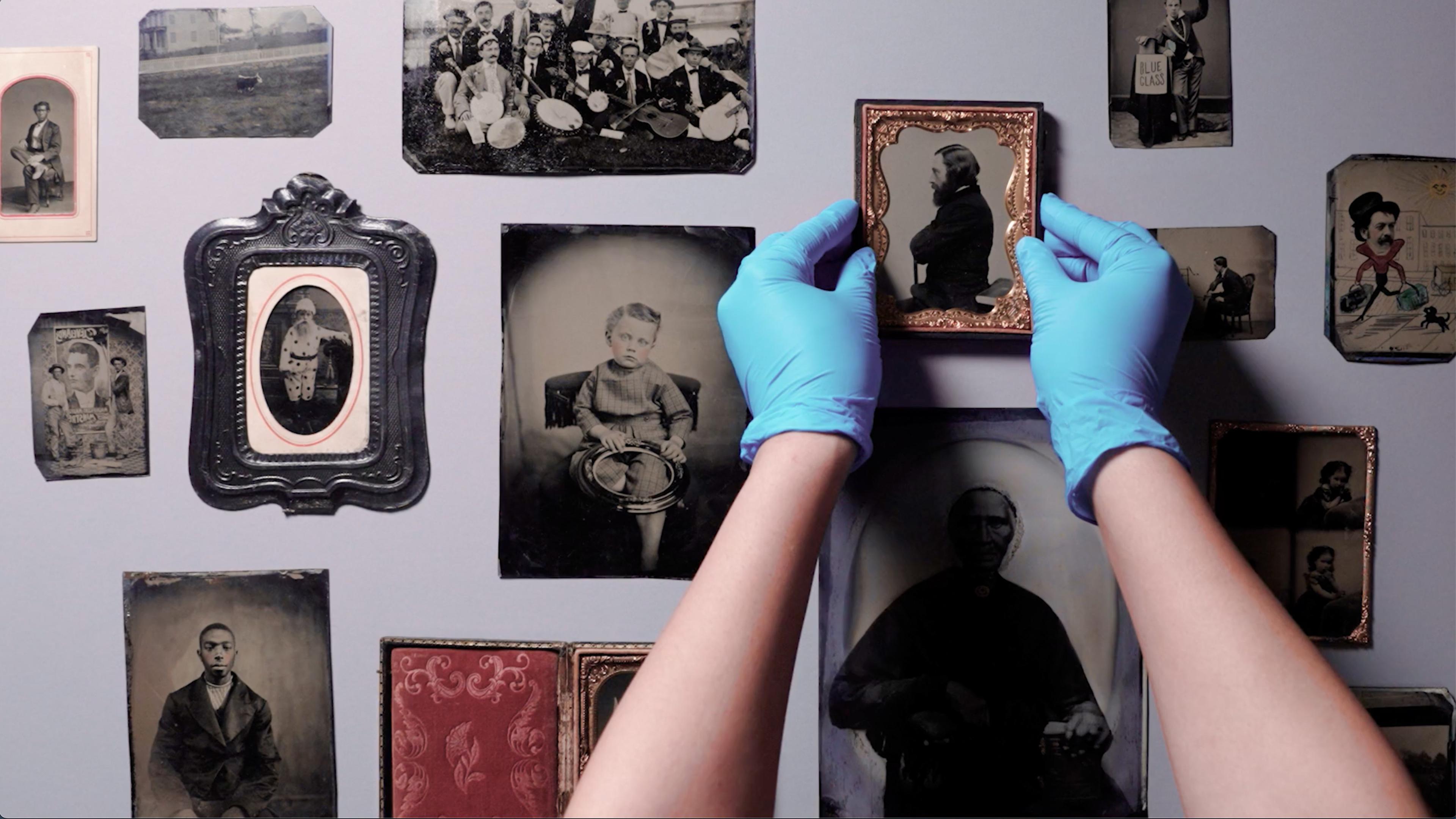 Hand with blue gloves carefully placing image in order