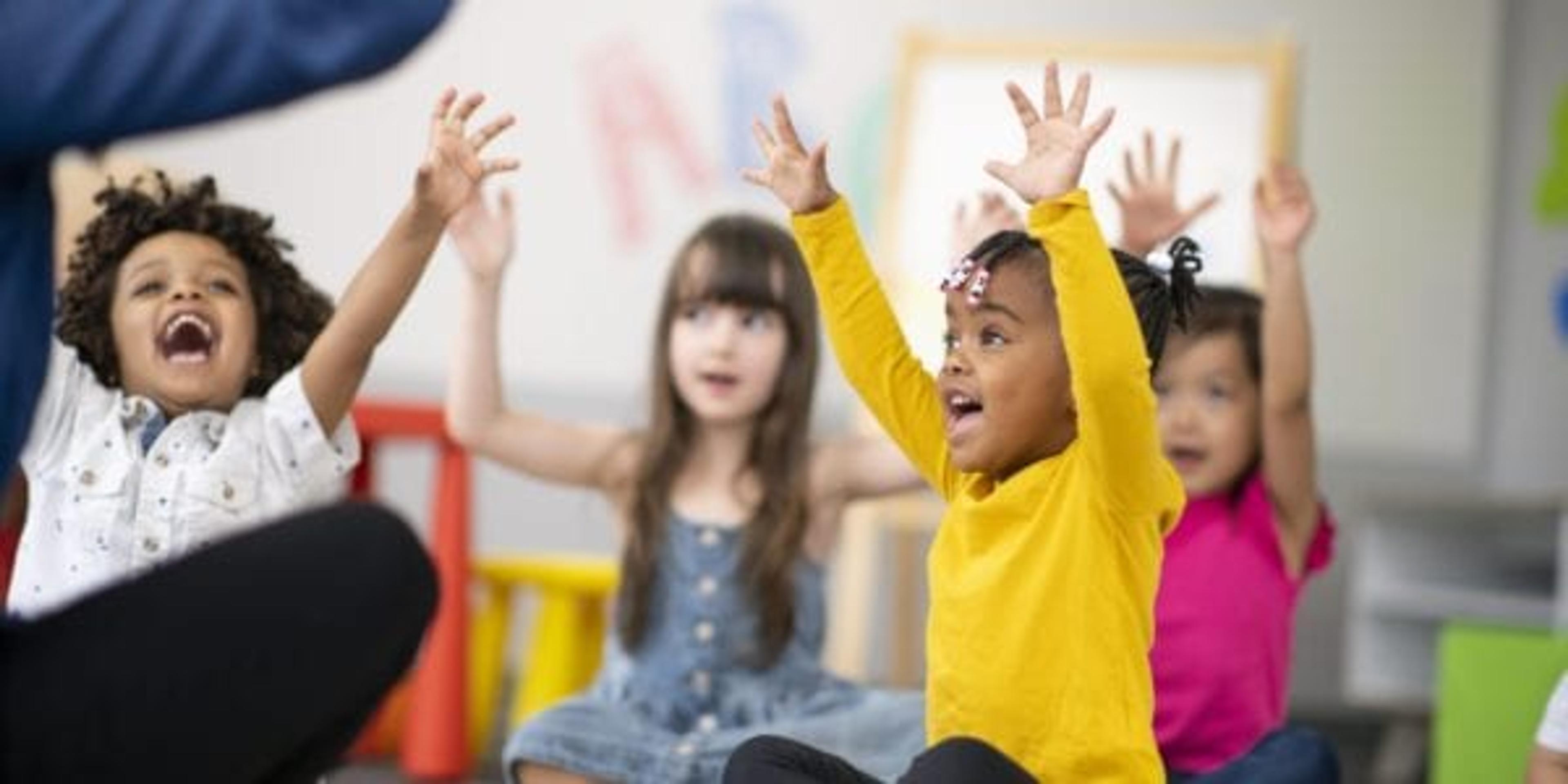 Preschoolers interacting in class