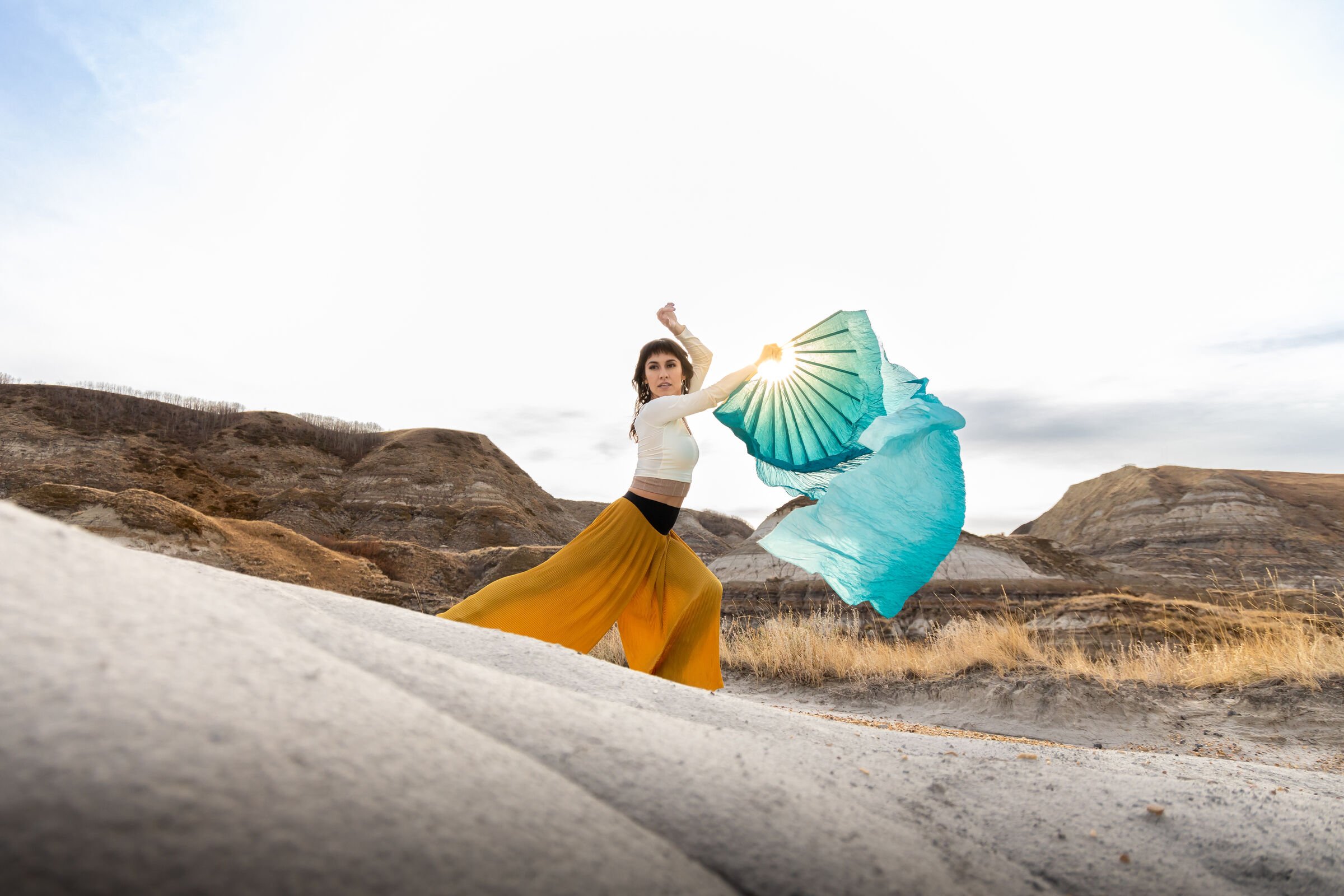 Indigenous dancer in hoodoos.